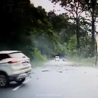 Rockfall on a mountain road in Bovo County, China.