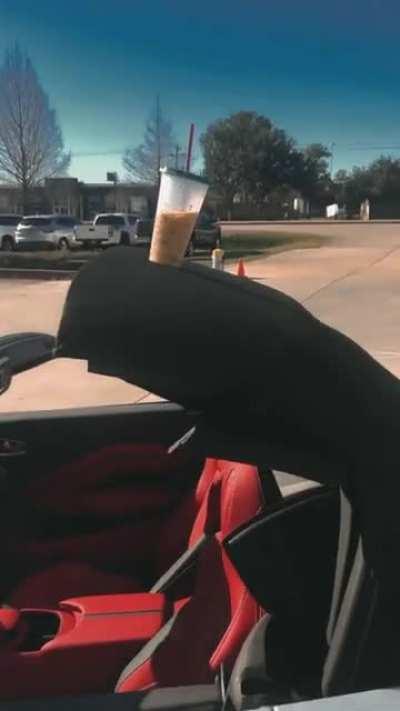 Cup on convertible roof.