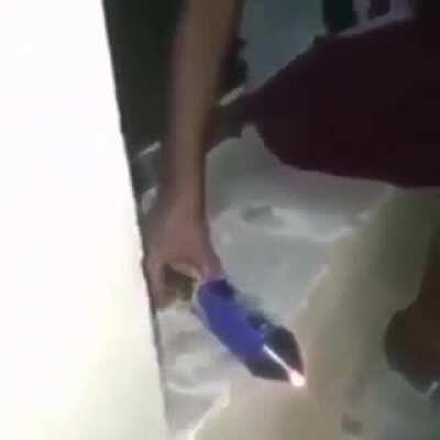 lighting a firework from the front