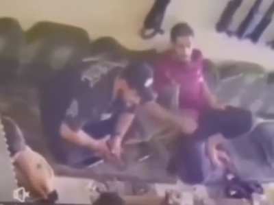 Man shot him self  by accident while setting among his family