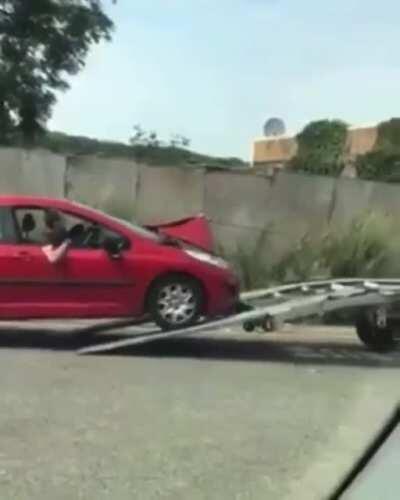 WCGW Placing the towing hook on the hood.