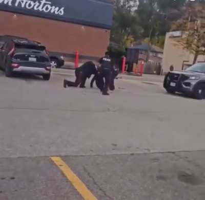 Cop car rolls over suspect after he gets tased, then get's told to stop resisting while he's squirming in pain from being run over.