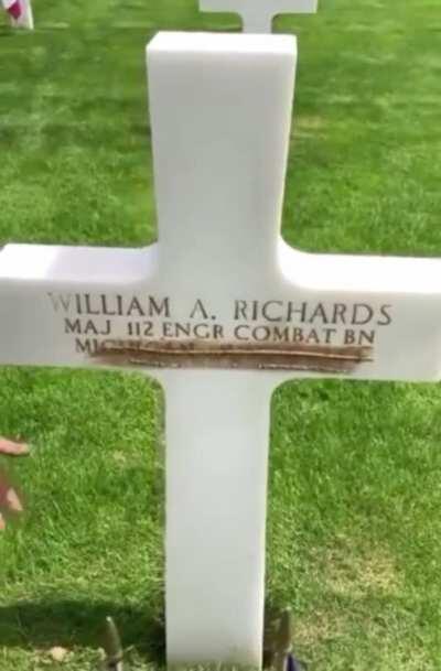 French caretakers take the sand from Omaha Beach and scrub them into the letters to give them the brown/gold coloring.