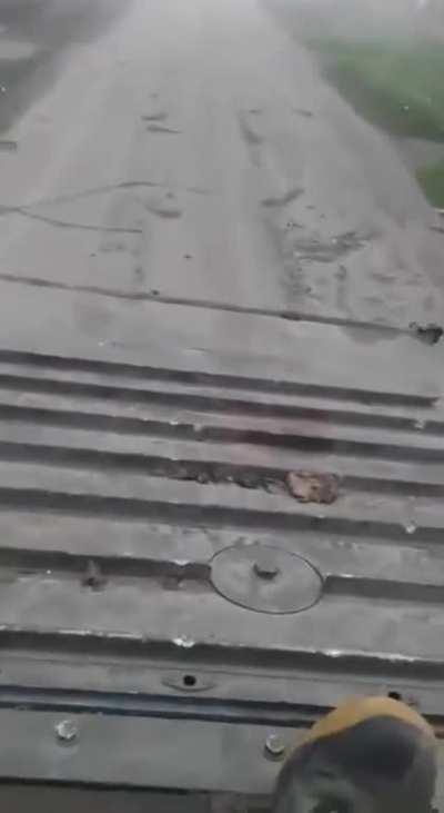 Ua pov. Ukraine troops drive through a village on fire and smoke, Kherson Oblast