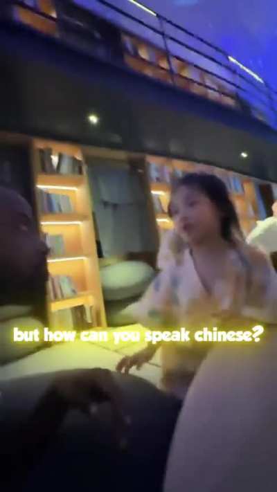 Two Chinese girls meet a black man for the first time