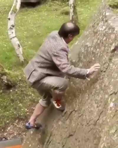 This man climbing rock like a goat