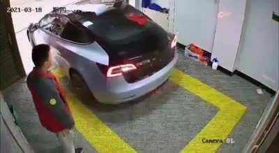 to reverse the Tesla into the garage