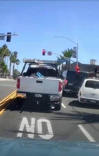 Truck driver swerves into a smaller car, gets mad and starts a road rage fight, and gets his ass handed to him