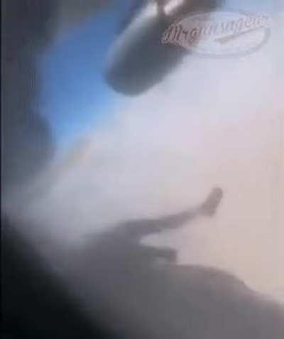 WARNING: GRAPHIC. Footage showing a person trapped on the exterior of a US military transport aircraft as it took off from Kabul airport