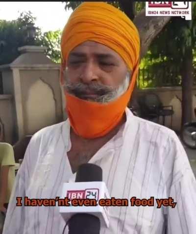 The journalist disarms a crazy man after he brings out a sword for being asked to pay for his food.