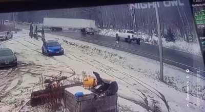 Trailer truck loses control on icy hill. Amazingly, no one died.