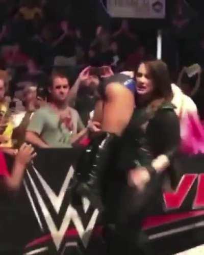 Alexa Bliss being carried around