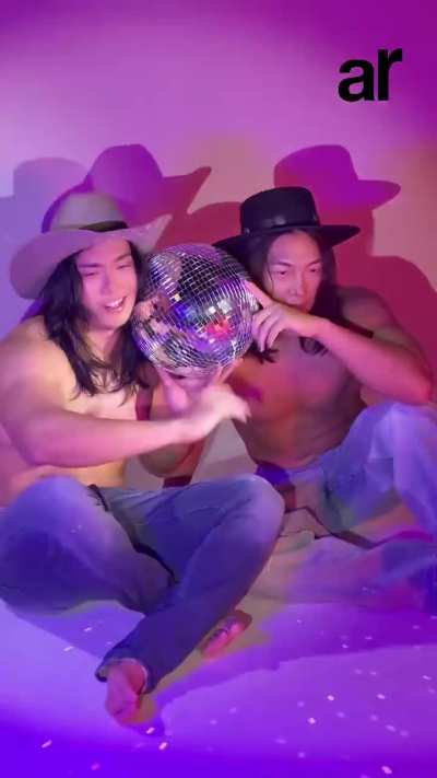 Konosuke Takeshita and Takeshi Masada from DDT posing for the magazine cover of 