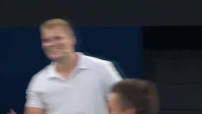 Novak Djokovic playing cricket on the Tennis court.