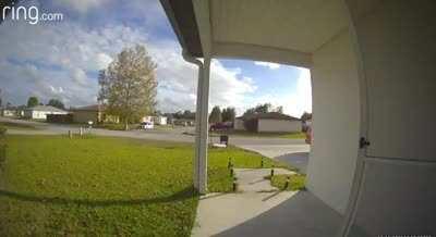 Two kids do their best avoiding a doorbell camera as they sneak out of their house