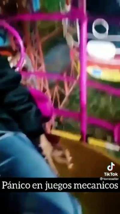 Ferris Wheel starts falling apart while people ride it.
