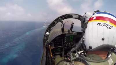 Landing a $100Million Fighter Jet on a moving Aircraft Carrier whilst your helmet says ‘No Pro’