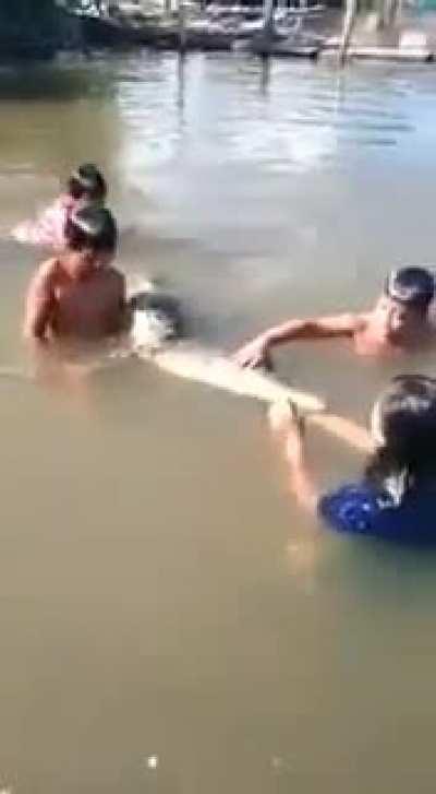 Kids playing with their pet fish
