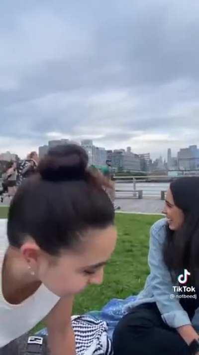 Little kids scooter into a massive crowd of people running. Some of the joggers stop to block people from accidentally hitting the kids.