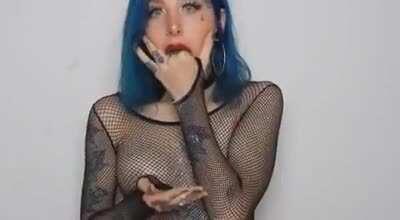 Blue Hair Light Blue Eyes Many Tatoos And A Puking Smile