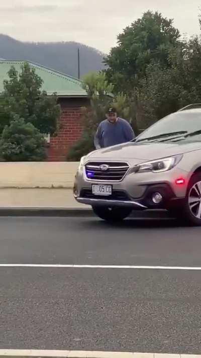 Bloke with a knife surrounded by cops gets mowed down.. by a Subi!