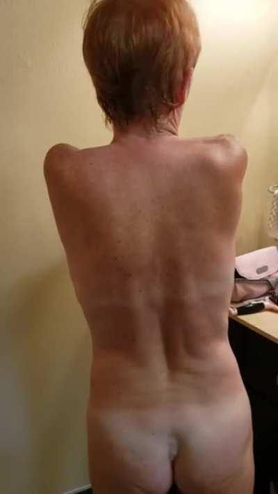 Wife (54) applying lotion after a day at the beach. Like the view?