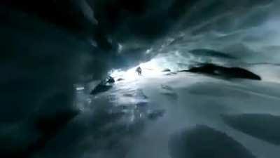 Going under the glacier on a board