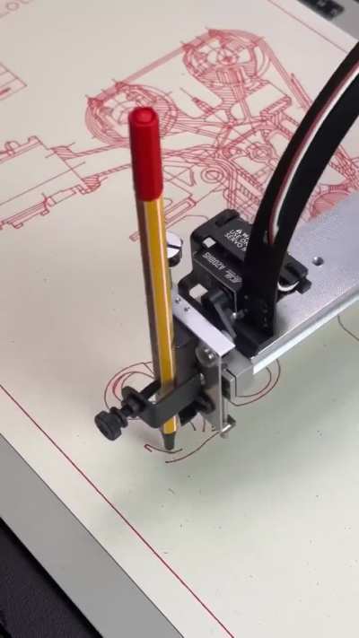Robot drawing an engine blueprint