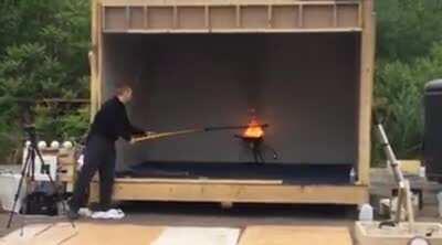 One cup of water being poured on a pretty small grease fire.