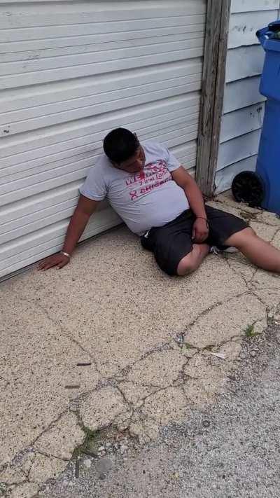 Random guy passed out against my neighbor's garage