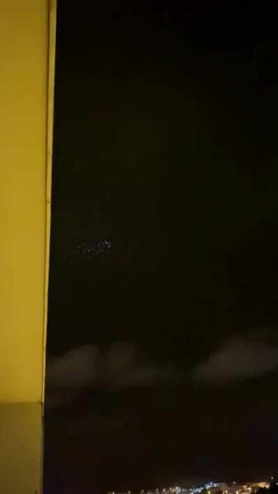 Last night, I saw a cluster of gleaming blue lights moving rapidly in the night sky