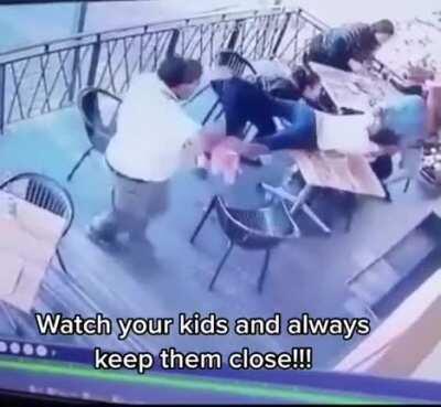 Guy tries to kidnap kid in front of parents