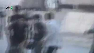 Early-war FSA fighters attempting to extract wounded come under MG fire before a mortar shell lands in their midst - Damascus - 10/23/2012