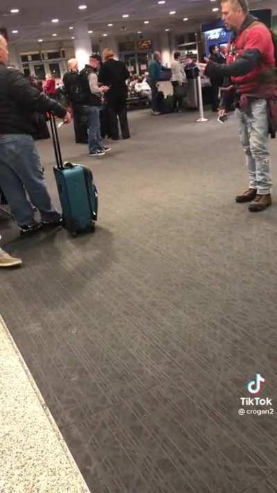 Airport meltdown with a Radiohead reference.