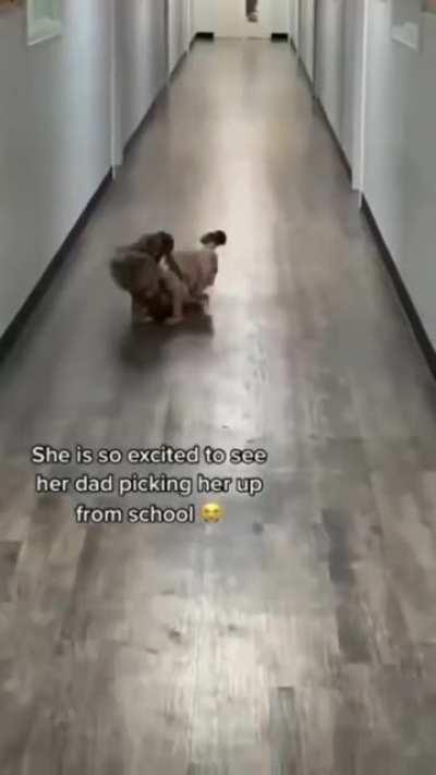 Little girl runs to her father when picked up from preschool