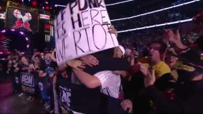 pro wrestling crowd goes nuts as CM Punk returns to professional wrestling after 7 years. Wow.