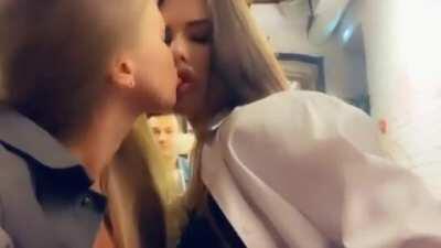 Kissing her girlfriends