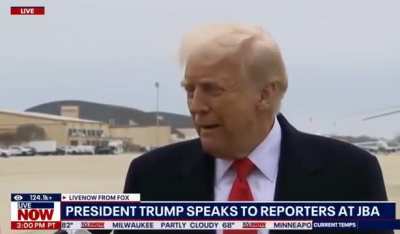 Reporter accidentally pushes microphone into Trump's face