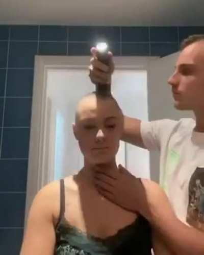 The power of true love. His gf has alopecia(condition with excessive hairfall) and hence she decided to go bald
