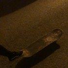 A friend of mine learns a new skateboarding trick.