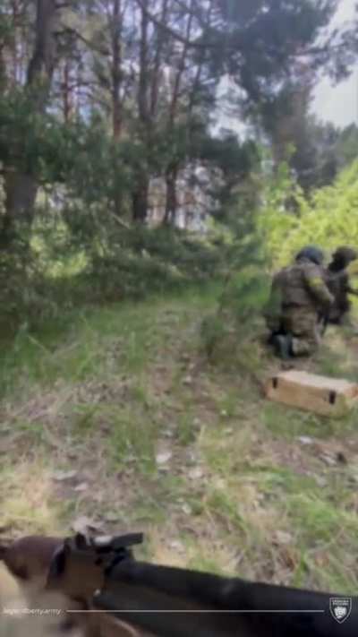 Mortar launchers of the Legion of Freedom of Russia are firing at enemy positions somewhere in the BPR.