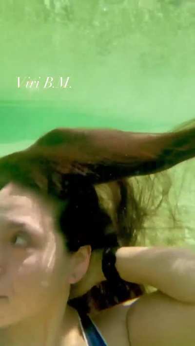 Viri B.M blows very pretty bubbles in a river