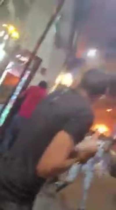 WCGW standing outside during a barrage of missiles