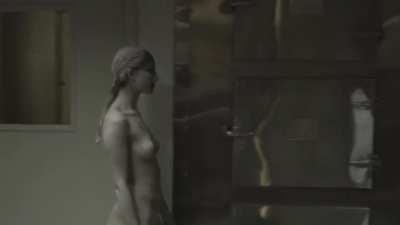 A naked poppy walking around in the teaser trailer for ghostemanes album