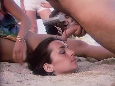 The legendary “buried in sand” oral sex scene from “In the Heat of St Tropez” (1982) feat Cathy Ménard