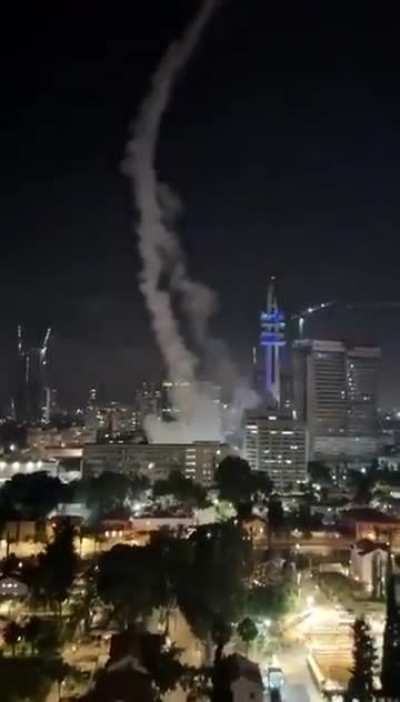 The moment an Iranian missile struck a site in Tel Aviv during the initial wave of attacks.