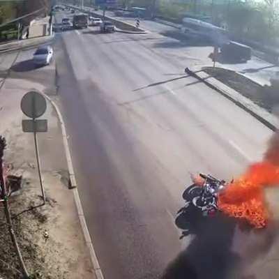 Hitting an oil leak in the road.