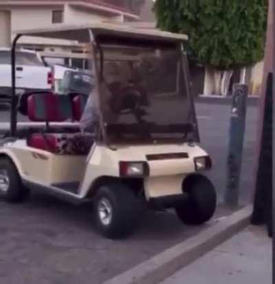 Old man tries to drive cart