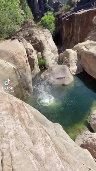 Quadruple backflip cliff jump