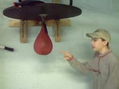 Kid gets owned by punching bag